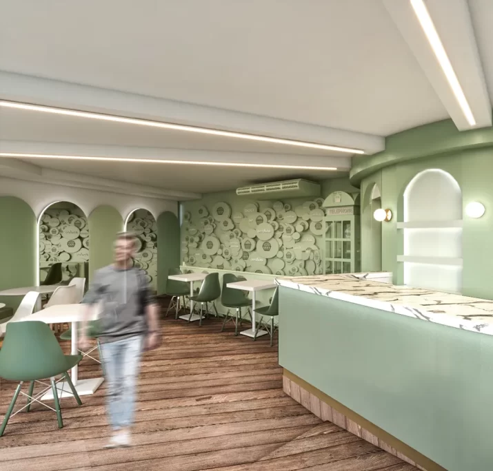 Projeto para confeitarias com decoração em tons de verde, mobiliário moderno e parede personalizada, criando um ambiente acolhedor e temático.