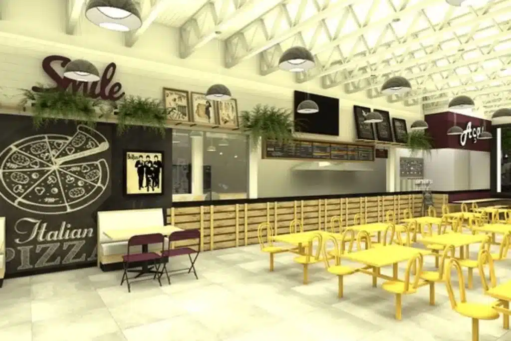 Decoração para restaurante com estilo industrial, mesas amarelas e elementos gráficos em preto e branco