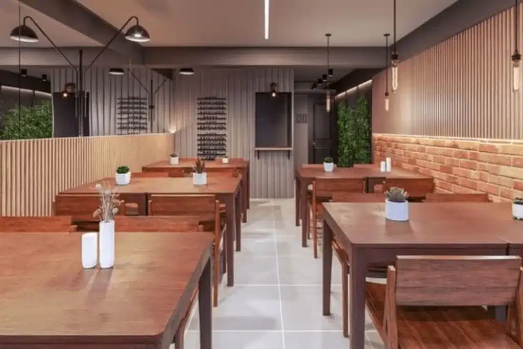Decoração para restaurante com paleta marrom, iluminação quente e materiais naturais
