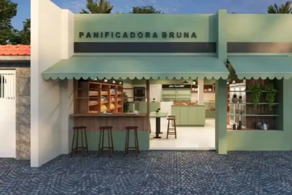 Fachada comercial de padaria charmosa com toldo verde e balcão externo