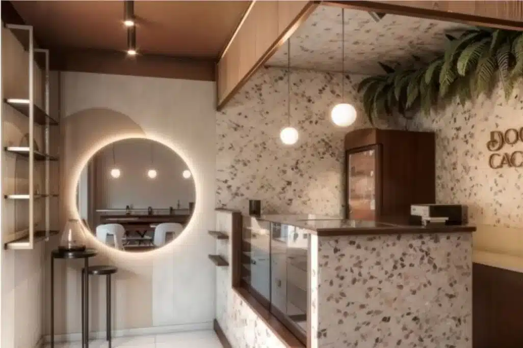Projeto de ponto comercial pequeno com balcão de atendimento e iluminação moderna
