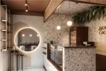 Projeto de ponto comercial pequeno com balcão de atendimento e iluminação moderna