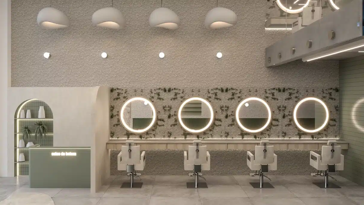 Estações de atendimento em salão de beleza com espelhos iluminados e revestimento texturizado.