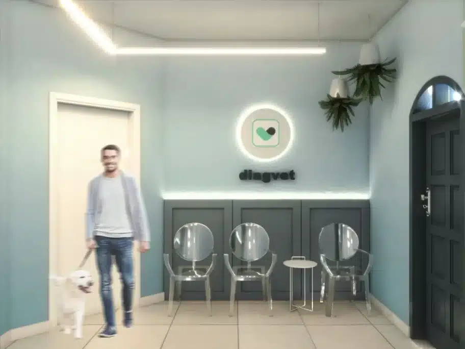 Sala de espera de clínica veterinária com cores neutras e tons pastéis.